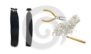 Women hair extension accesories and a fake black or dark har tail. Concept shot of a fake hair tail, pliers, and micro rings,