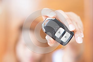 Women Hand Holding Car Remote Control Key
