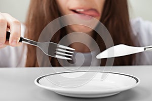 Women hand holding fork and knife