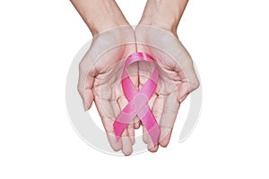 Women hand holding pink ribbon breast cancer on white background