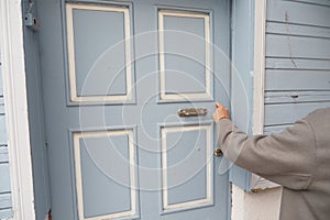 women hand knock the door