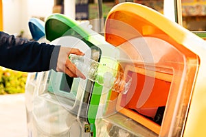 Women hand throwing away the garbage to the bin/trash, sorting waste/garbage before drop to the bin