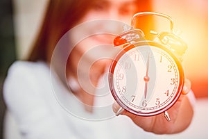 Women hand up show clock timed at 6 o& x27;clock.