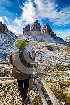 Women hand using a compass in the mountains, travel concept. Han