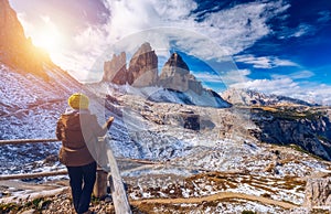 Women hand using a compass in the mountains, travel concept. Han