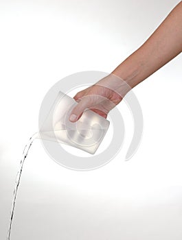 Women hand watering with container