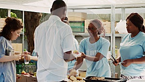 Women handing out food to the needy