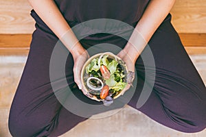 Woman hands holding with eating healthy salad for breakfast,Clean eating and dieting