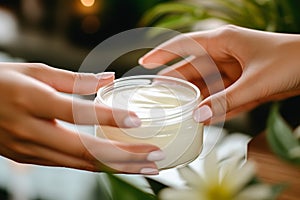 Women hands touching cosmetic jar of face or body cream close up. Moisturizing and nourishing, beauty cosmetic product