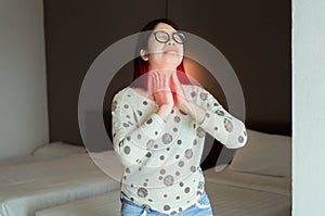 Women have a sore throat,Female touching neck with hand,Healthcare Concept photo