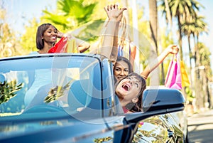 Women having fun while driving in Beverly hills