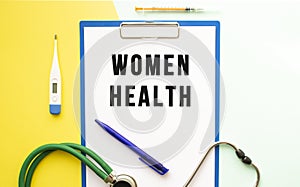 WOMEN HEALTH text on a letterhead in a medical folder on a beautiful background.