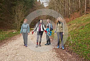 Women hikers with backpacks in the mountains