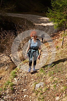 Women hikers with backpacks in the mountains