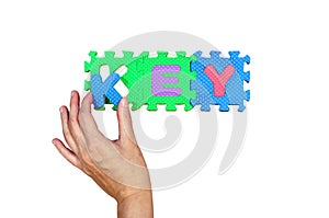 Women hold K alphabet put to its hole for successfully key word