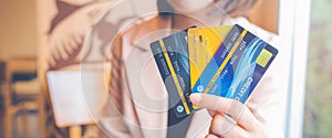 Women hold three credit cards