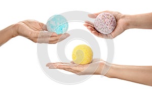 Women holding aromatic bath bombs