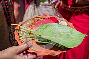 A Women holding a borondala Pooja thali for worshipping God in Sindur Khela at a puja pandal on the last day of Durga puja