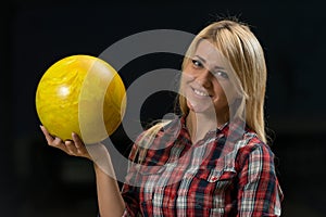 Women Holding A Bowling Ball