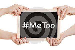 Women holding chalkboard with metoo sign in their hands