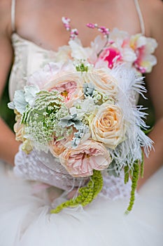 Women holding flowers and bouquet