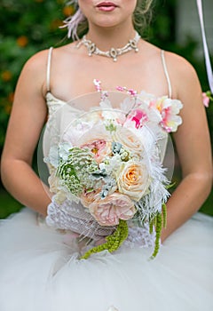 Women holding flowers and bouquet