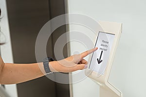 Women holding key card access control to unlock elevator floor and choose the floor