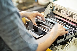 Women holding Laser toner cartridge ,replacing toner in laser printer at office. Repairs and Maintenance Laser printers concept