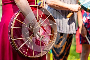 Women holding native american drum