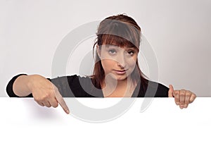 Women holding and pointing white page presenting display panel