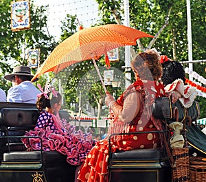Women in a horse carriage, Seville Fair, Andalusia, Spain