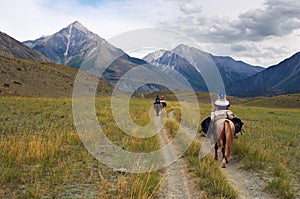 Women on horseback.