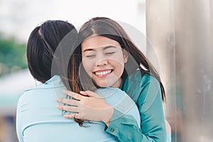 Women hugging each friend