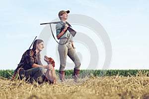 Women hunters with hunting dog