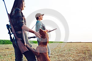 Women hunters with hunting dog