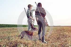 Women hunters with hunting dog