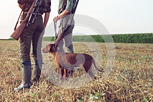 Women hunters with hunting dog