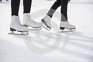 Women ice skating on ice rink