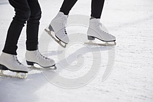 Women ice skating on ice rink photo