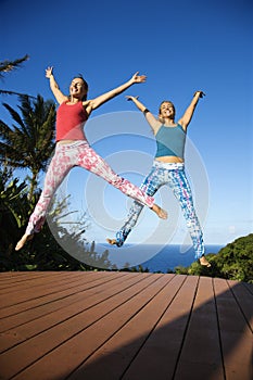 Women jumping into air.