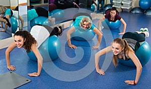 Women jumping on exercise ball