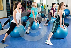 Women jumping on exercise ball