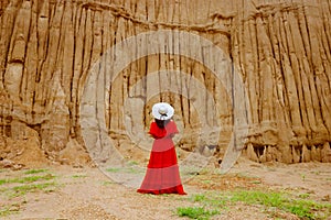 Women and landscape of soil textures eroded sandstone pillars,