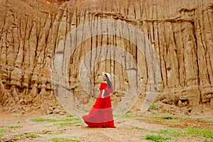 Women and landscape of soil textures eroded sandstone pillars,