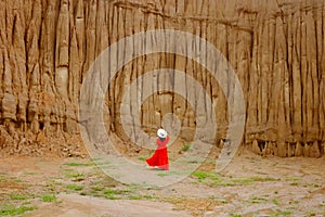 Women and landscape of soil textures eroded sandstone pillars,