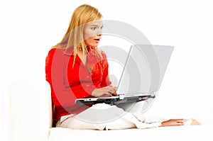 Women with laptop on couch