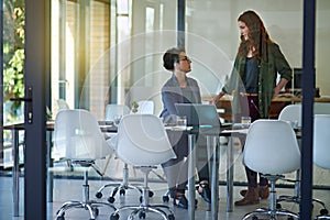 Women, laptop or talking in startup meeting for brainstorming, research or planning together. Business people