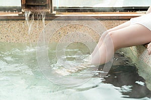 Women leg foot soak in the hot spring