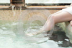 Women leg foot soak in the hot spring photo