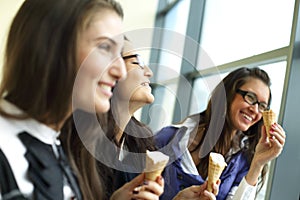 Women licking ice cream